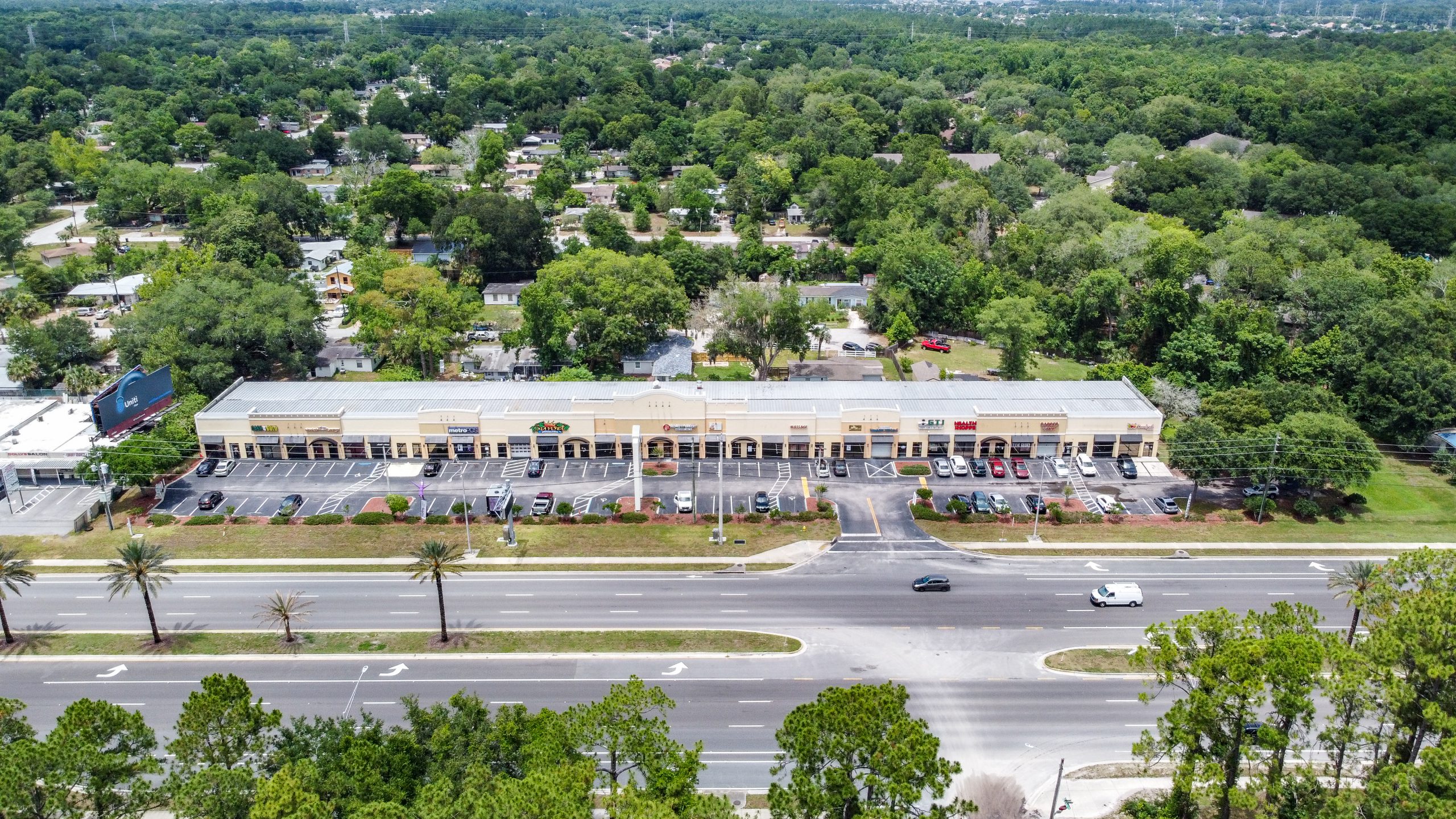 An aerial view of A one-story retail center.