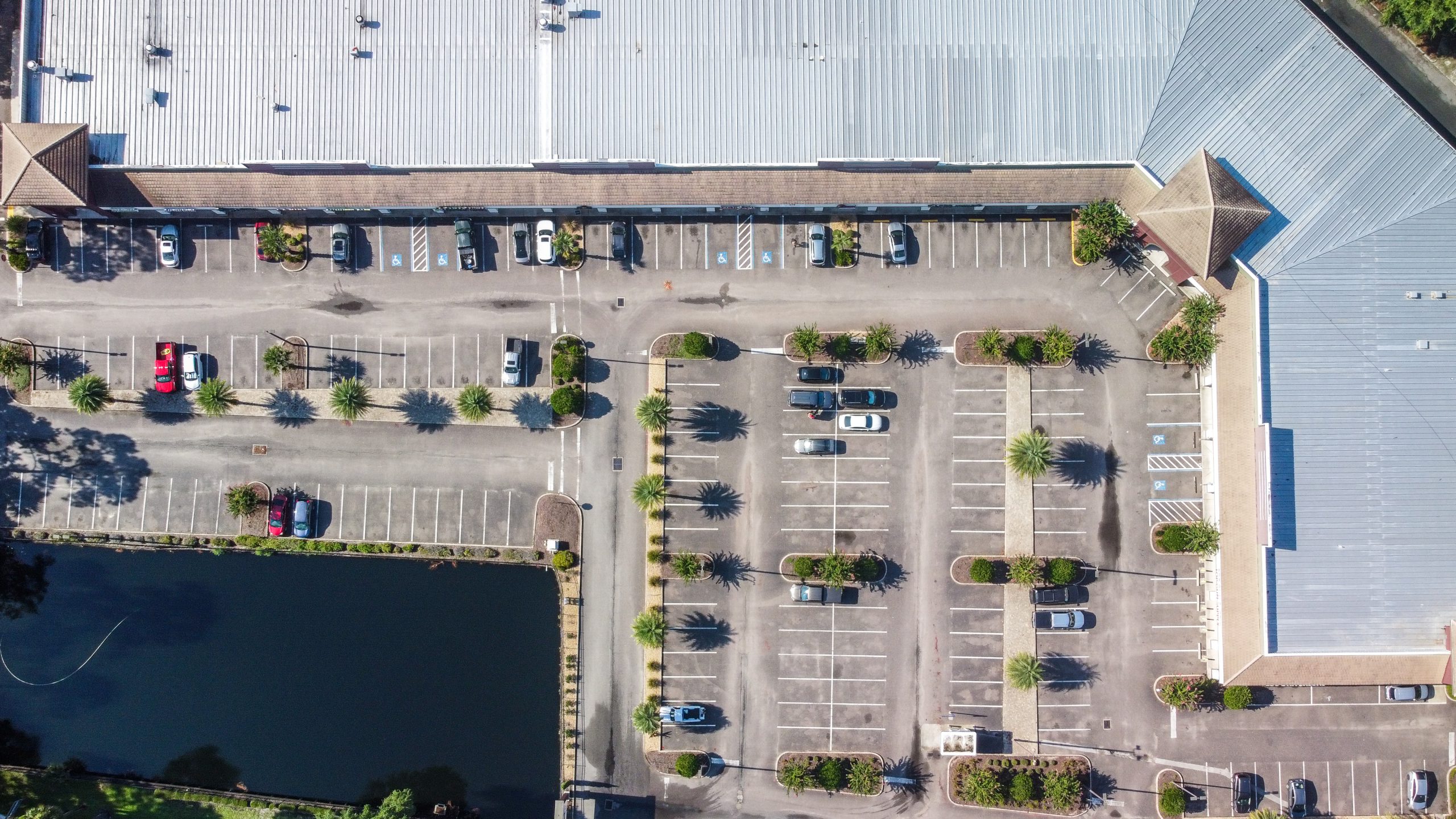 An aerial view of a retail center & parking lot.