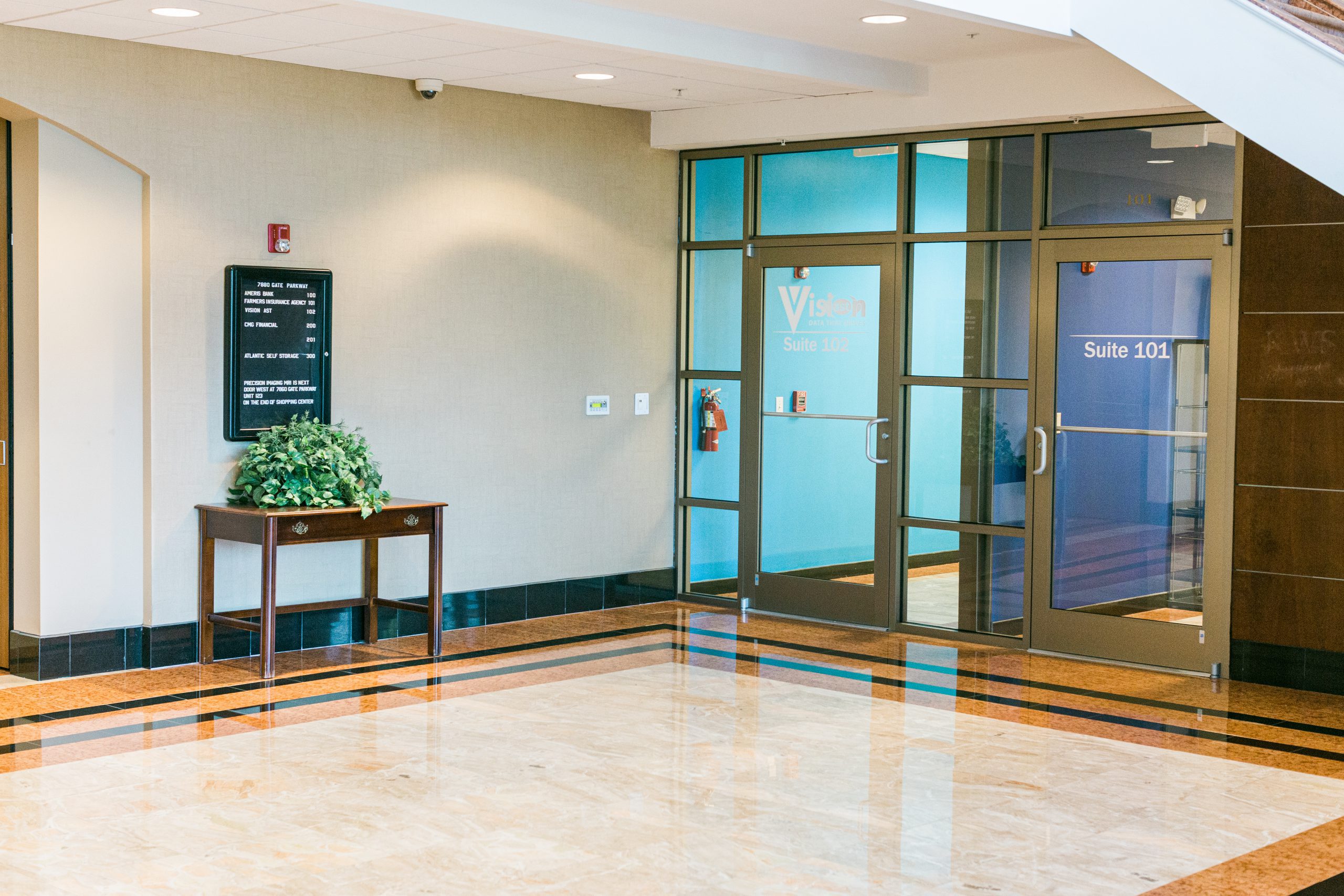 A lobby with glass doors.
