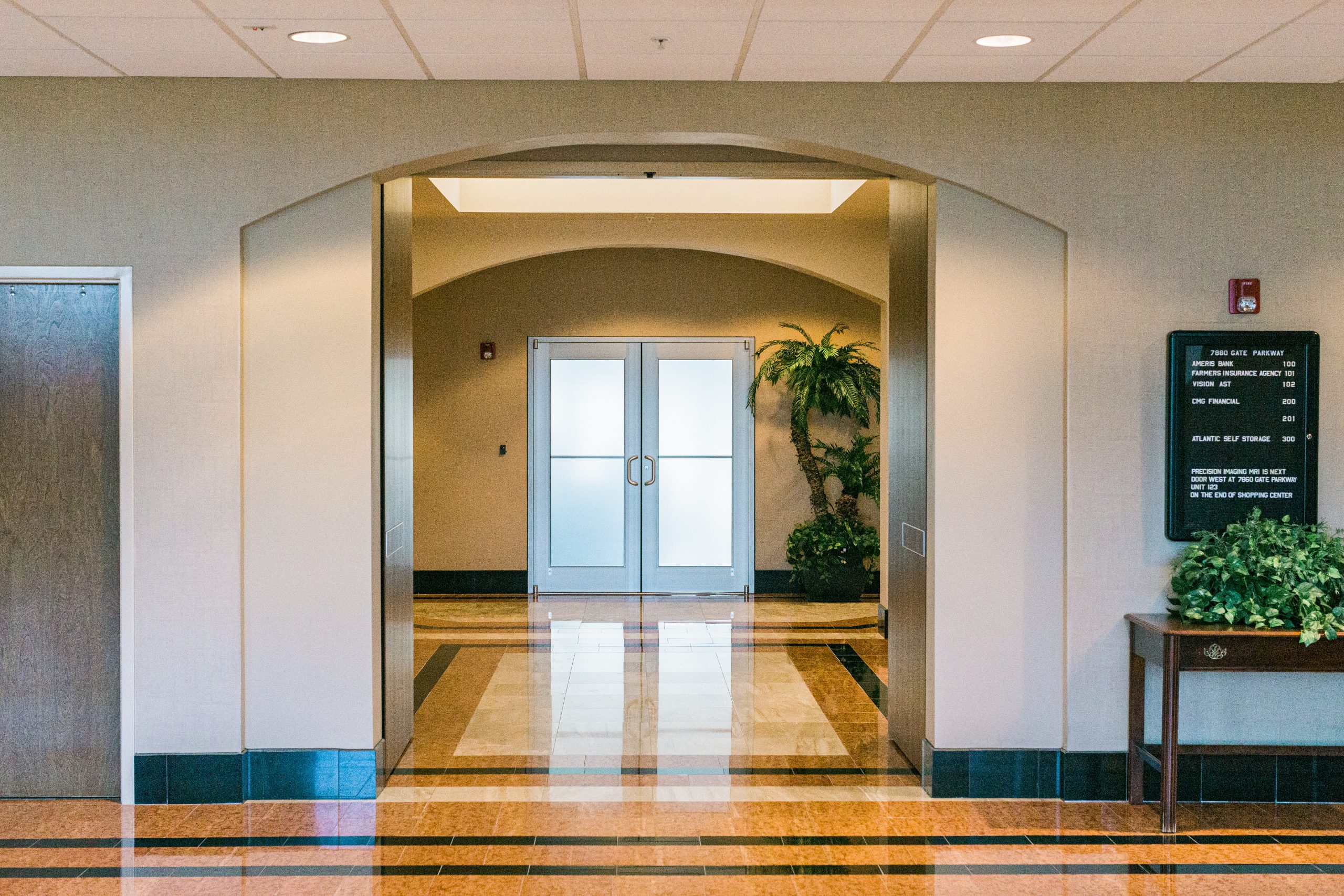 A lobby with glass doors.