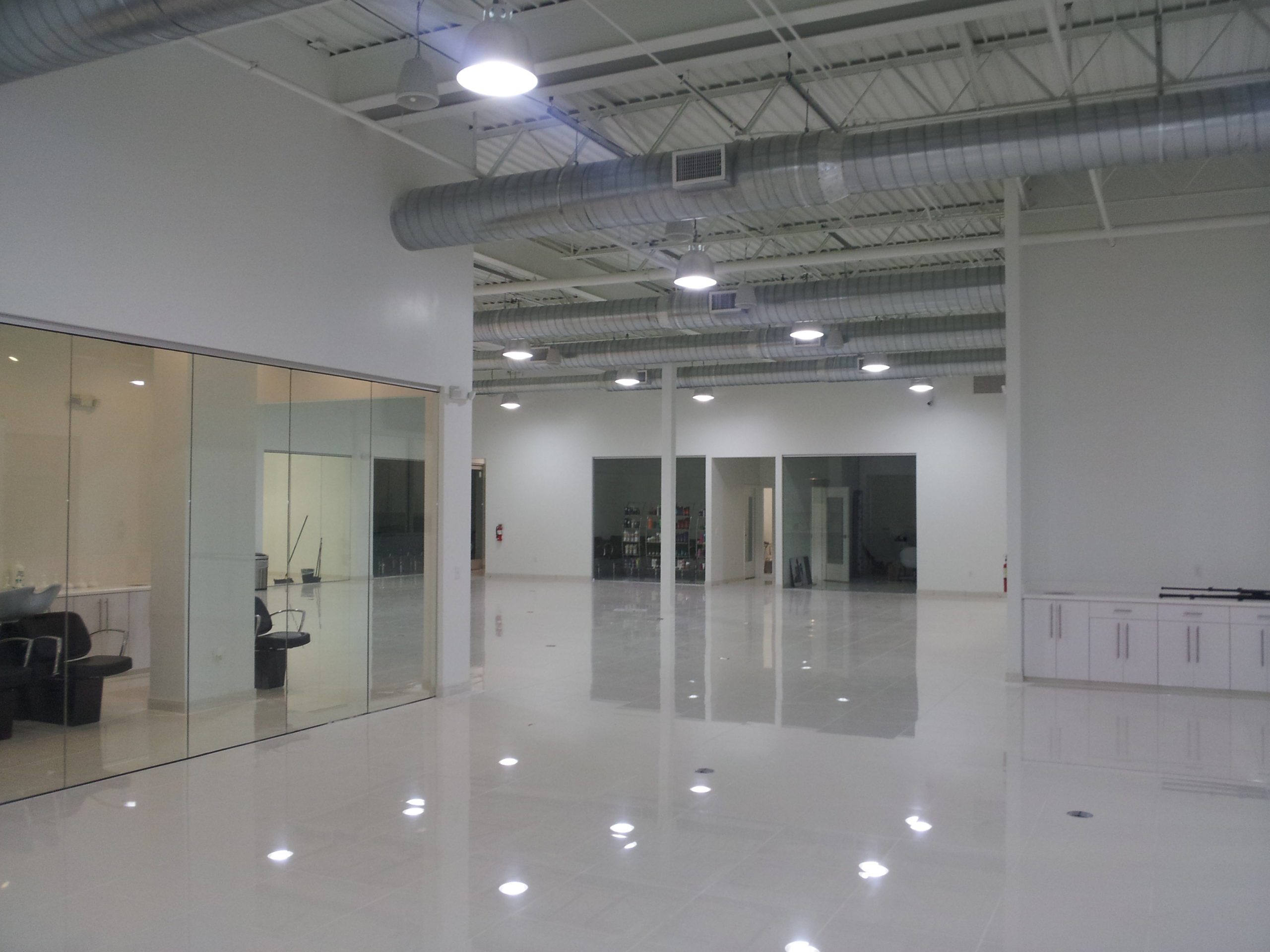 A large, open room with tall ceilings and white walls.