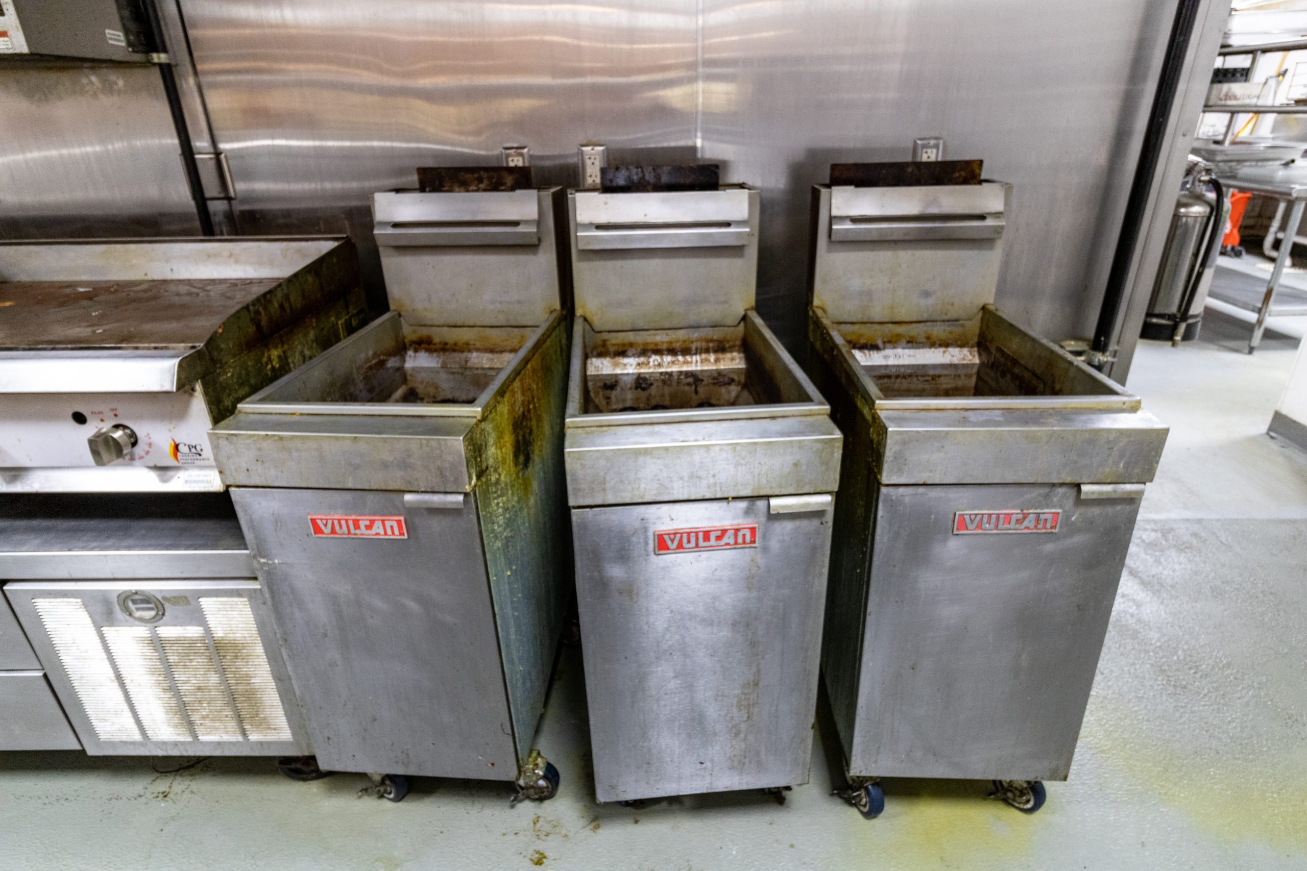Three commercial fryers.